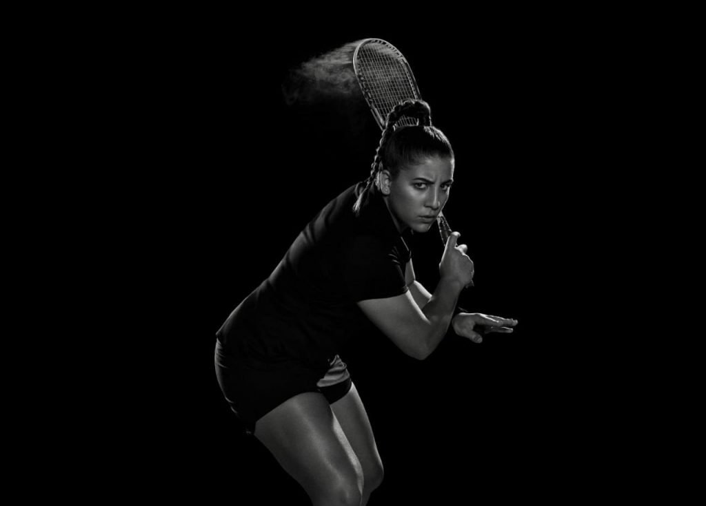 Kanzy El Defrawy poses with the squash racquet