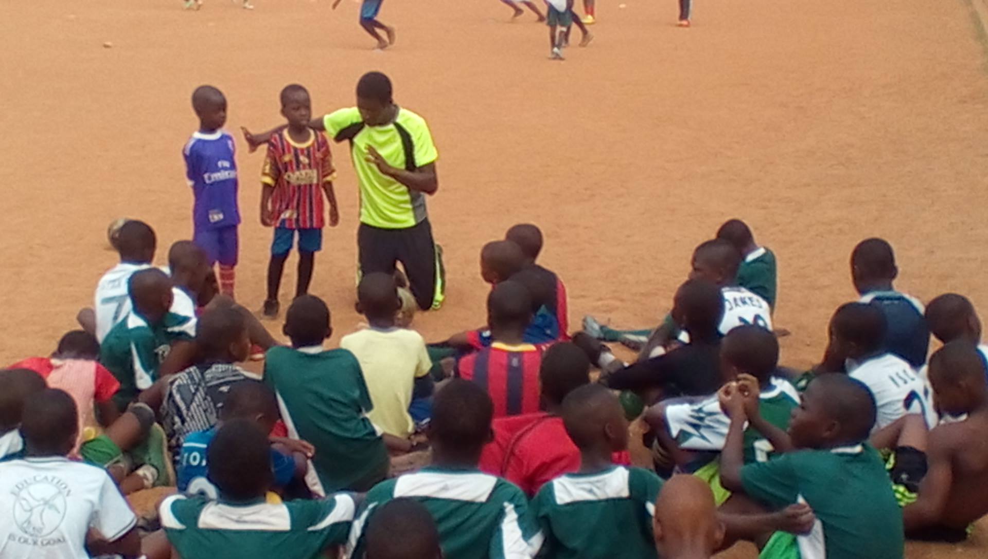 Children are instructed about football