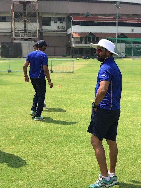 Feature person in the cricket ground, wearing a white hat at a BCCI session